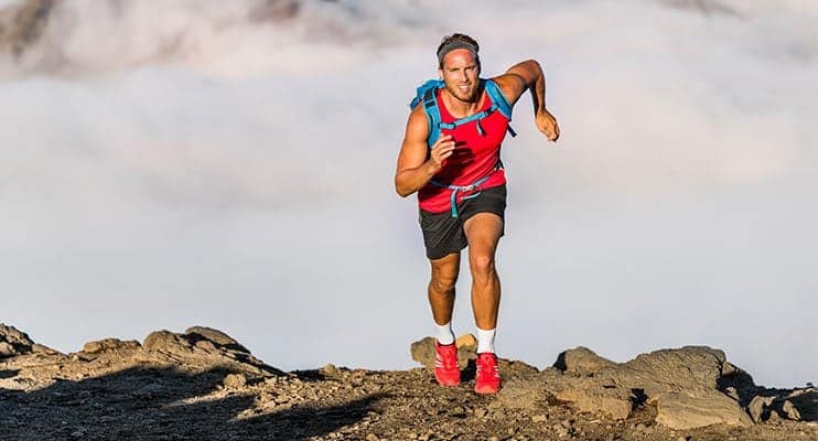 Endurance Athlete Hiking Up Big Mountain