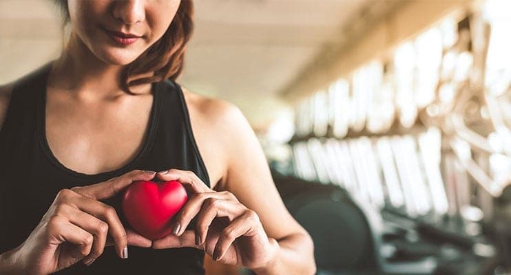 Pretty Girl Holding A Plush Heart