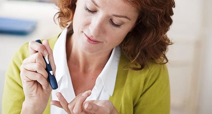 Woman With Diabetes Pricking Her Finger
